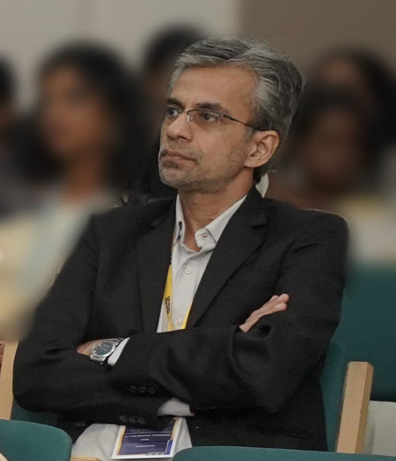 Jeetendra J, founder of The Print Specialist, seated at an industry conference